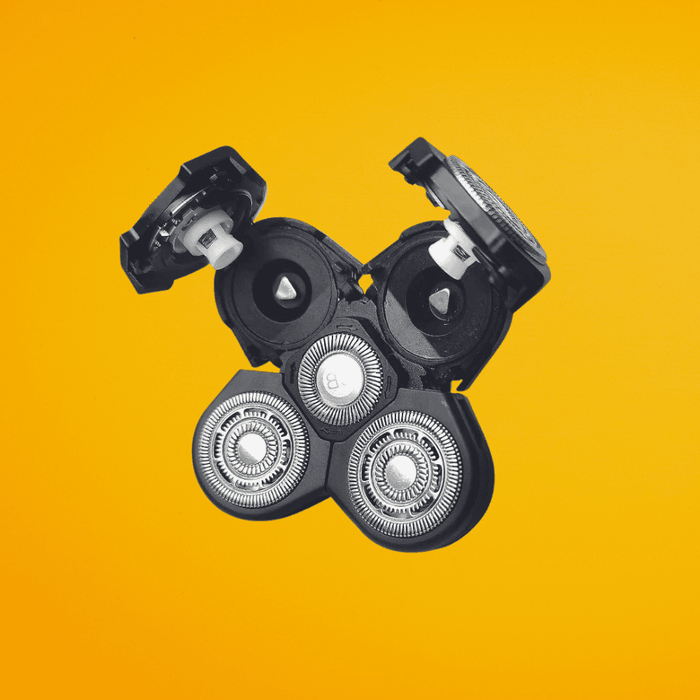 Replacement 5-head rotary shaver blade attachment for The Cut Buddy, featuring a hinged open design for easy cleaning and debris removal.