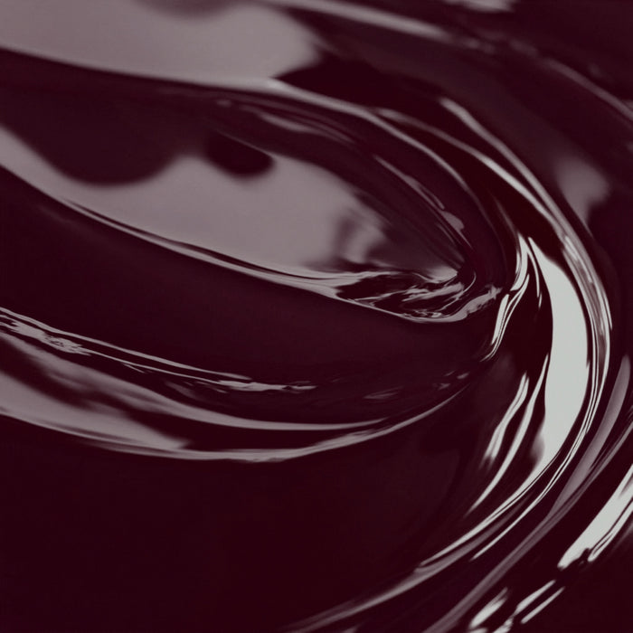 Close-up image of a highly concentrated black cherry liquid candle dye.