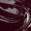 Close-up image of a highly concentrated black cherry liquid candle dye.