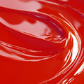 A close-up image of a red liquid candle dye.