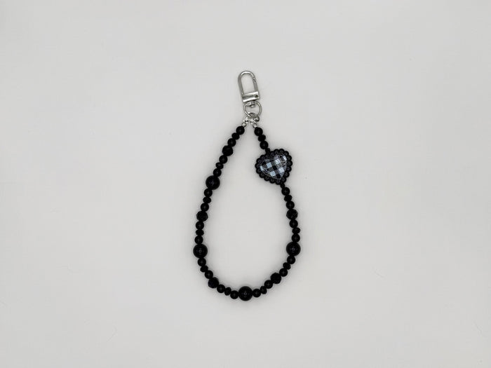 Black beaded keychain wrist strap with gingham heart charm and silver swivel clip