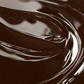 A close-up image of a chocolate brown liquid candle dye.
