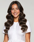 woman wearing clip in hair extensions ash brown