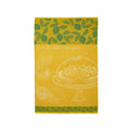 A yellow cotton tea towel with green leaf patterns and an illustration of a lemon tart at the top.