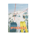 A multicolored cotton tea towel with a printed design depicting a winter sports scene and the text 'Les Pyrénées'.