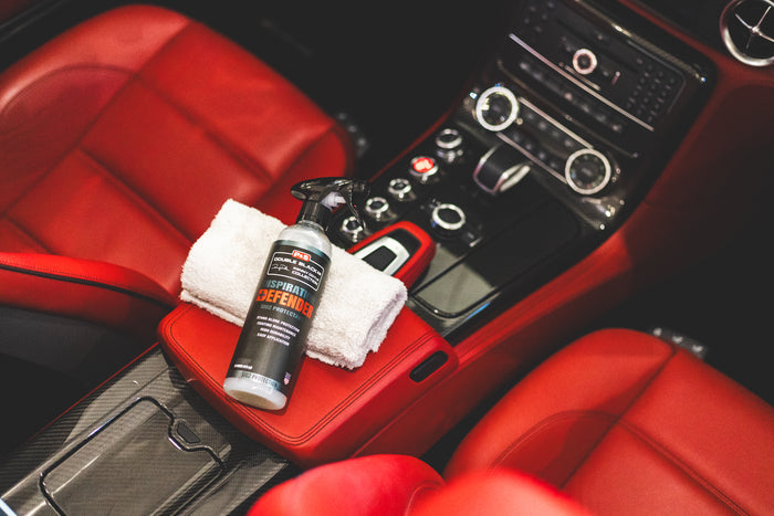 P&S Inspiration Defender laying on top of a microfiber towel inside of vehicle.