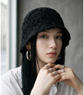 Black crochet lace bucket cap with rounded crown and scalloped brim