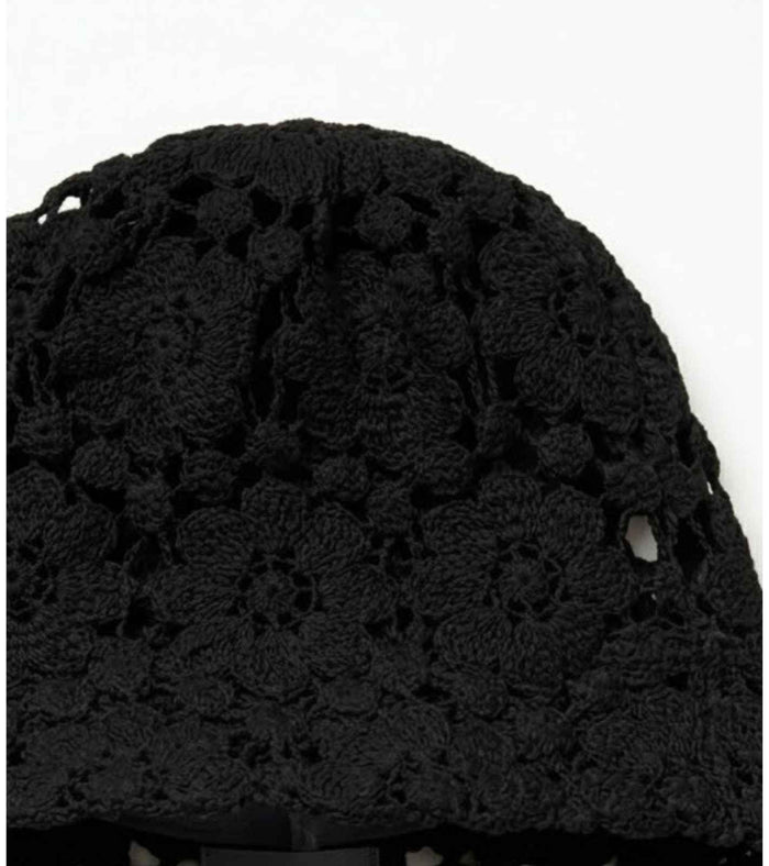 Black crochet lace bucket cap close-up with floral open-knit texture and side eyelet