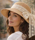 Sand straw sun hat with wide brim and lace ribbon bow on side
