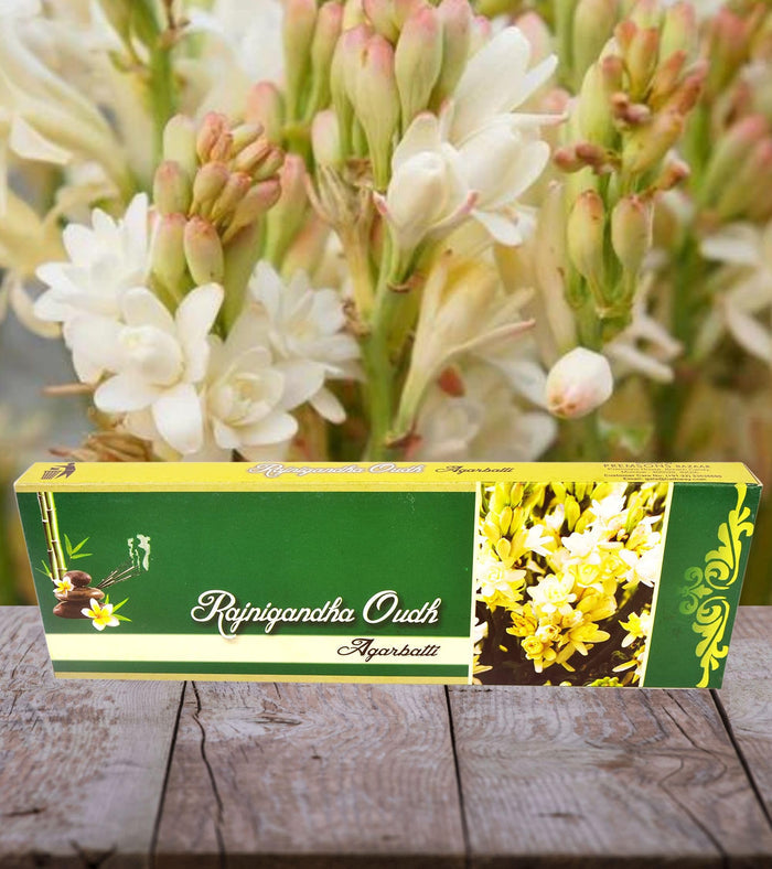 Incense stick pack on wooden surface with white flower artwork