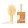 Body brush with natural bristles and wooden handle next to its packaging on a white background