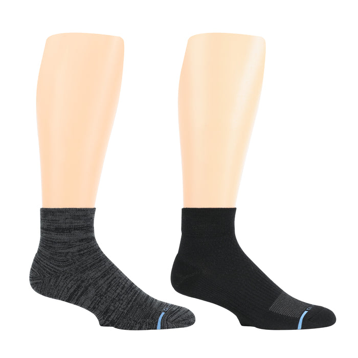 Quarter-length compression socks in black and dark gray, displayed on mannequin legs.