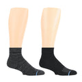 Quarter-length compression socks in black and dark gray, displayed on mannequin legs.