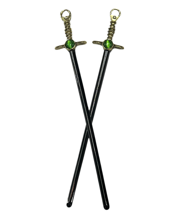 Gold Gem Sword Hair Sticks with green gemstone accents, medieval sword-inspired fantasy hair accessories, front view on white background.