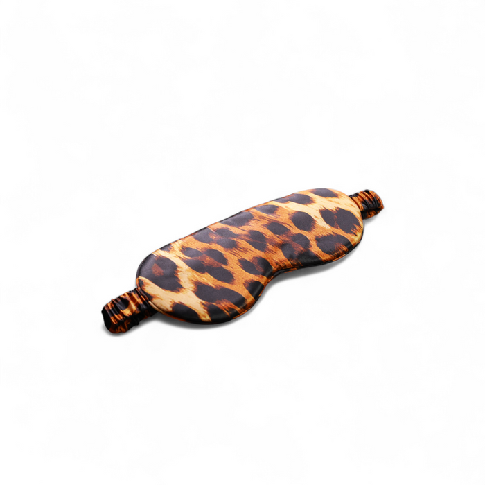 Leopard print eye mask on a white background