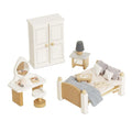 Set of wooden furniture including a bed, wardrobe, and vanity table on a white background