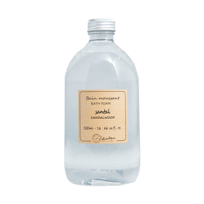 Bottle of bath foam with a sandalwood label on a white background