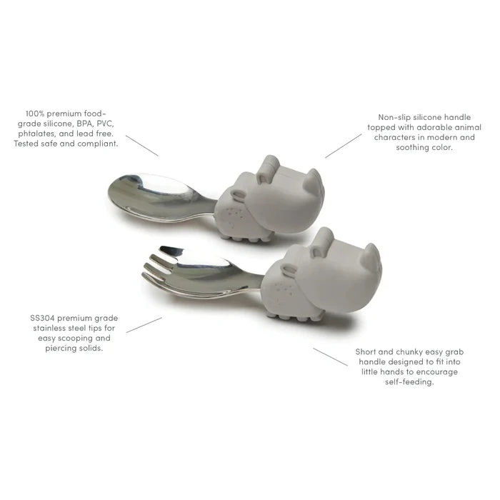 Children's silverware set with animal handles on a white background