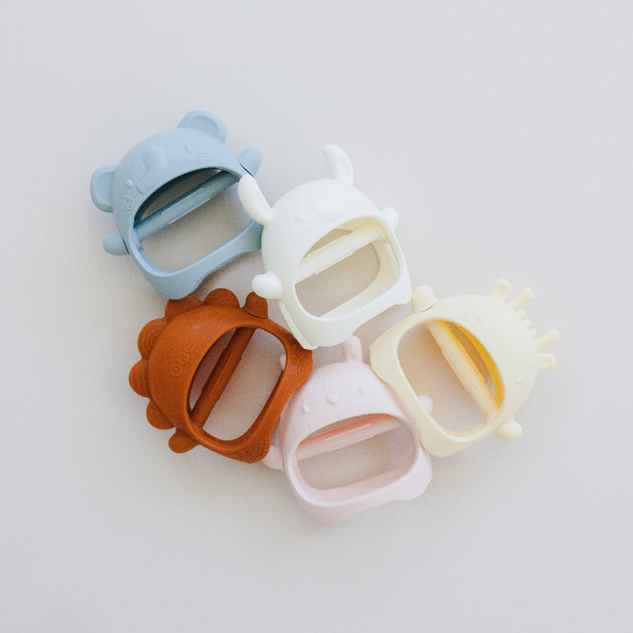 Set of colorful silicone phone case protectors on a light gray background
