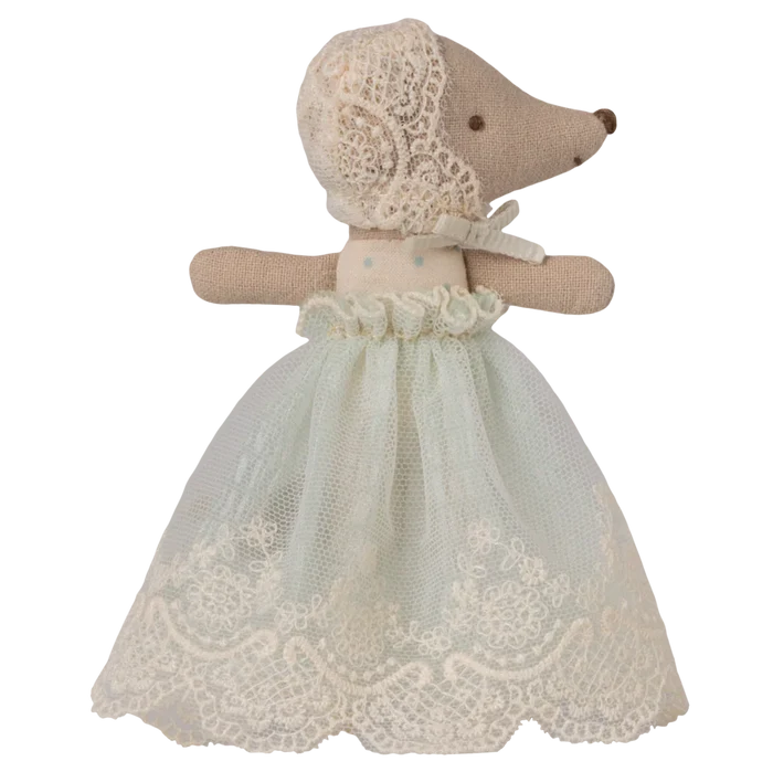 Toy Mouse dressed in a lace dress on a white background