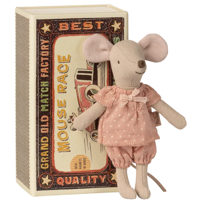 Stuffed mouse toy in a decorative box with text