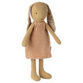 Stuffed bunny toy wearing a knitted dress on a white background