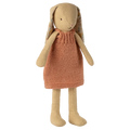 Toy rabbit with a knitted dress on a white background