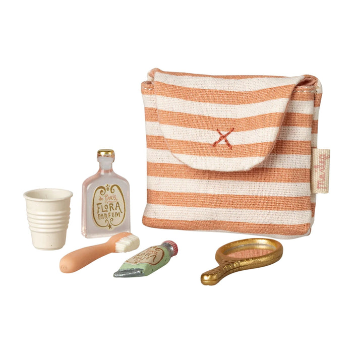 Striped pouch with miniature accessories on a white background