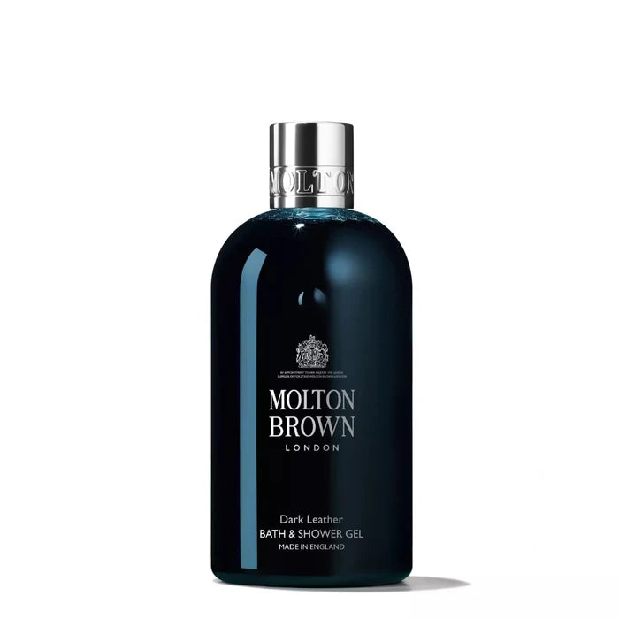 A dark leather bath and shower gel bottle with a silver cap, labeled Molton Brown.