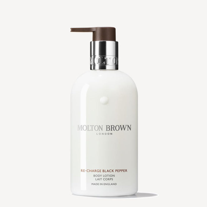 Molton Brown body lotion bottle on a white background