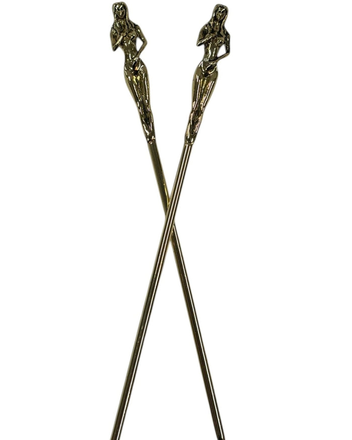 Gold Naked Lady Hair Sticks featuring sculpted female figures, decorative metal hair pins crossed on a white background.