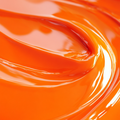Close-up of a highly concentrated orange liquid candle dye.