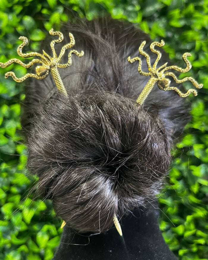 Model wearing Elegant Gold Pirate Squid Hair Sticks with octopus-inspired tentacle design securing a bun hairstyle.