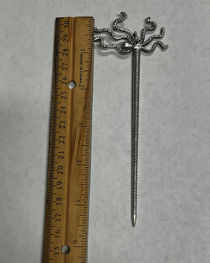 Pirate Squid Hair Stick shown next to a ruler for size reference with antique silver octopus-inspired tentacle design.