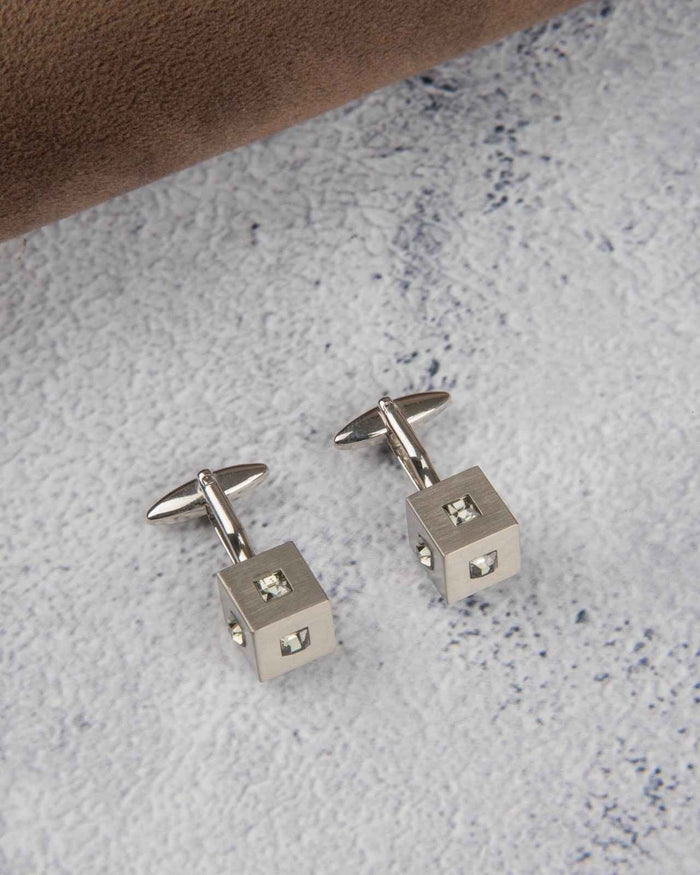 Silver cube cufflinks with clear crystal inlay, close-up square faces and bar backs