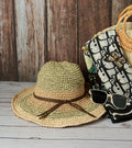 Woven straw beach hat with wide brim and olive-green rim