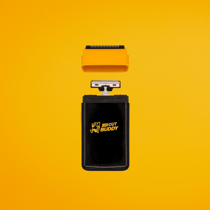 Professional grooming kit featuring an electric beard trimmer and a serrated orange guide for precise edging and detailing.