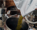 Pouring ingredients into a brewing kit