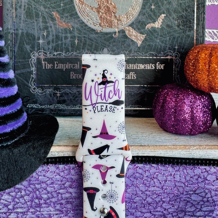 Single Witch Please Fitbit Versa 1/2 band strap standing to show the purple Witch Please script on cream silicone.