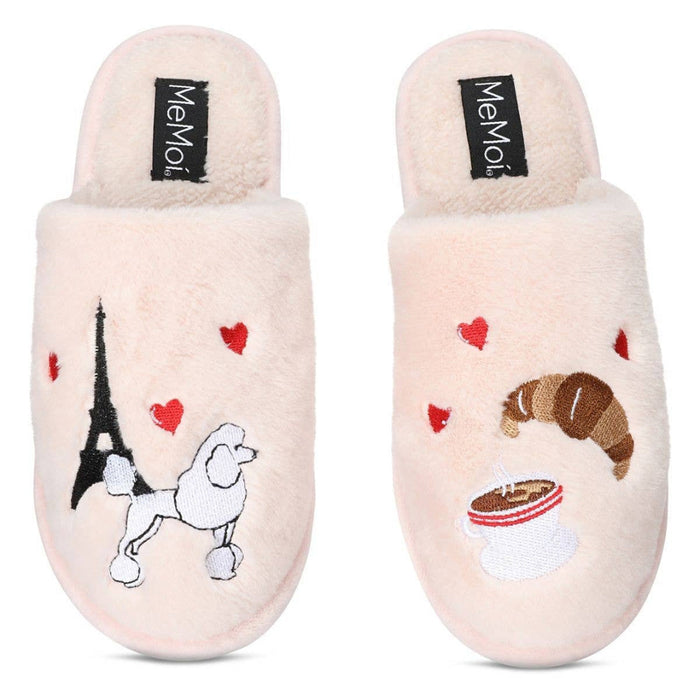 Pair of cream-colored slippers with Paris-themed designs on a white background